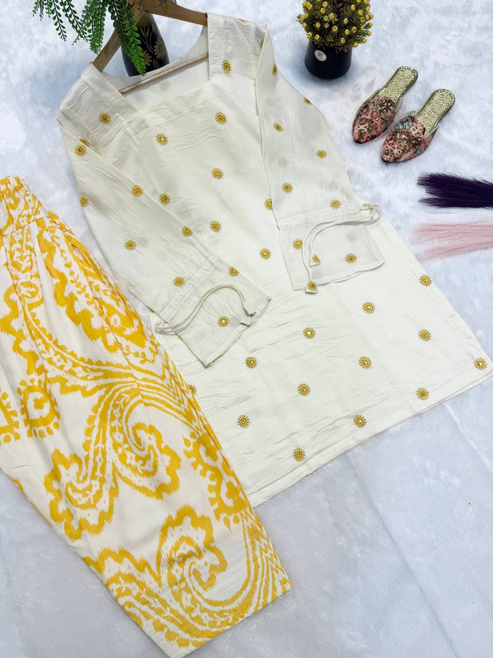 Radiant Ivory White Short Kurti Adorned with Sunshine Yellow Embroidery Paired with a Flowy Patterned Farshi Salwar